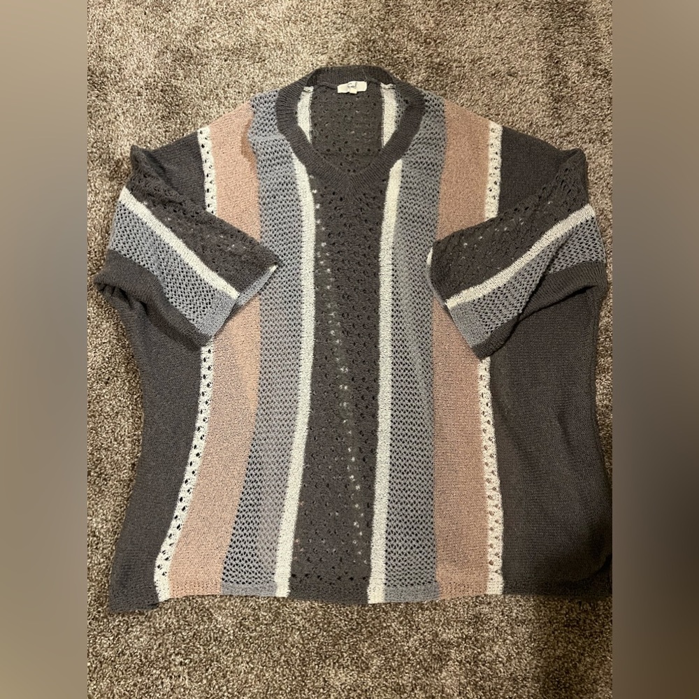 Never worn. Easel. Size large.